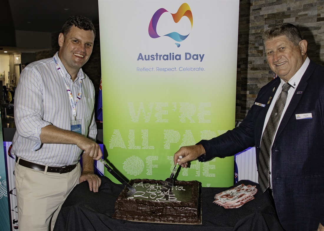 Corey-Payne-and-Mayor-cutting-cake.jpg